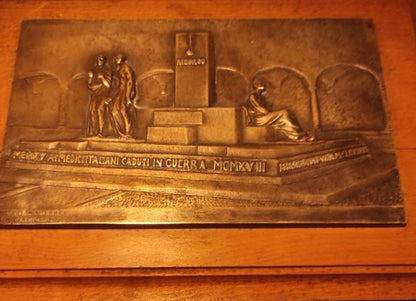 Silver plaque honoring the fallen Italians