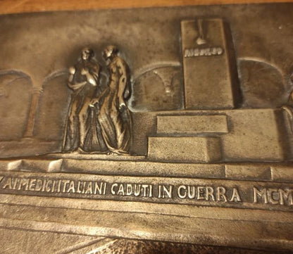 Silver plaque honoring the fallen Italians